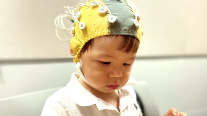 toddler with eeg cap